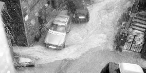 Una calle de Guijo anegada durante la tormenta. / A. G./