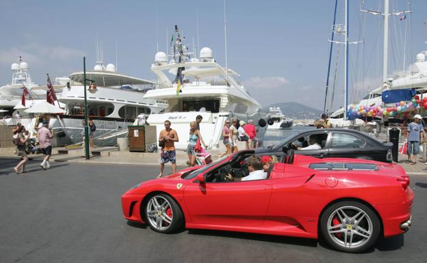 Yachts and luxury vehicles in Marbella. 